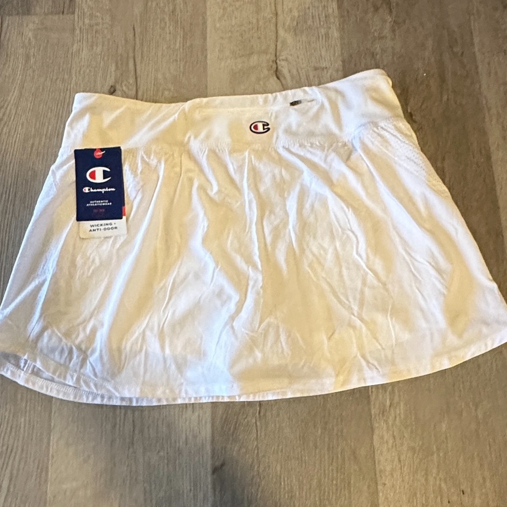 brand new with tags. White champion skirt. Size medium